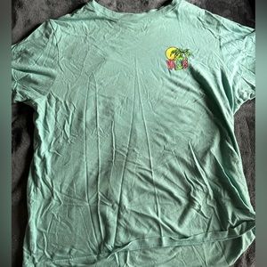 Vans green t-shirt with colorful palm tree design on front and back.